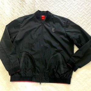 Nike men’s windbreaker, black size XL.